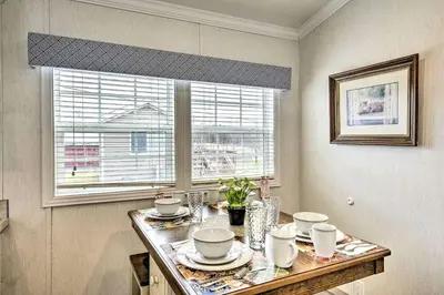 a kitchen with a table with dishes and a window at Great Vacation Complex for the Best Pennsylvania Glamping in Scranton
