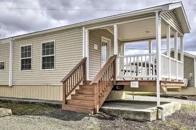 a house with a porch and a staircase on it at Great Vacation Complex for the Best Pennsylvania Glamping in Scranton
