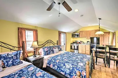 a bedroom with two beds and a kitchen at Remote Ski Rentals for a Gorgeous Pennsylvania Retreat in Pleasant Mount