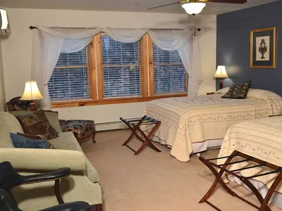 a bedroom with two beds and a couch at Enormous Family-Friendly Cabin Rental in Shawangunk Mountains, New York in Pine Bush