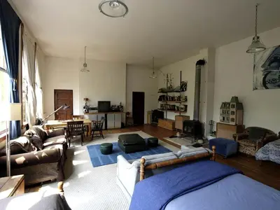 a living room with a couch and a table at Historic Vacation Rental with Music Studio in the Catskills near Hancock, New York in Hancock