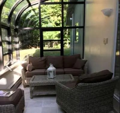 a living room with a couch and a table at Delightful Cottage Rental with Scenic Views near the Poconos, Pennsylvania in Tobyhanna