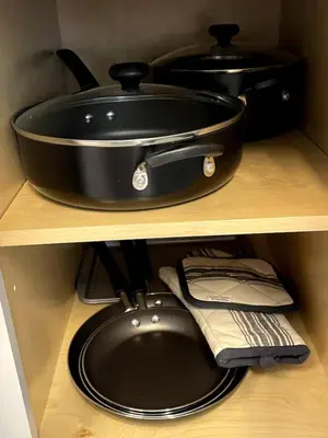 a pot and pan on a shelf in a kitchen at Sweet Diamonds & Adventures 10 Mins To NYC in Union City