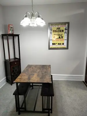 a dining room with a table and a picture on the wall at Entire 1 Bed room APT St Josephs UNI CITY AVE in Philadelphia