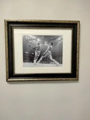 a framed picture of two baseball players on a wall at Entire 1 Bed room APT St Josephs UNI CITY AVE in Philadelphia