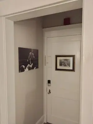 a hallway with a white door and a picture on the wall at Entire 1 Bed room APT St Josephs UNI CITY AVE in Philadelphia