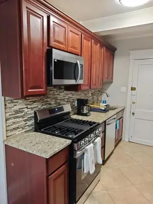 a kitchen with a stove and a microwave at Entire 1 Bed room APT St Josephs UNI CITY AVE in Philadelphia