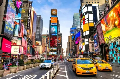 a busy city street with cars and buildings at Warm & Cozy Escape - NYC & NWK with Free Parking in Bayonne