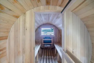 an inside view of a tiny house with a window at Catskills Lakefront with Hot Tub, Sauna and Theater in Monticello