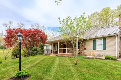a house with a lamp in the yard at Enola Trail Getaway - bikes, rural, BBQ ,King bed, patio in Pequea
