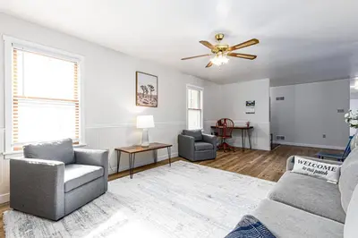 a living room with a couch and a ceiling fan at Enola Trail Getaway - bikes, rural, BBQ ,King bed, patio in Pequea