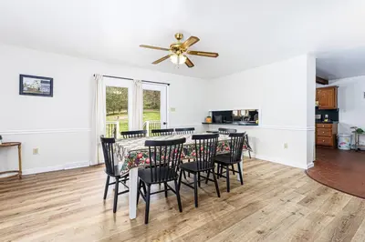 a dining room and kitchen with a table and chairs at Enola Trail Getaway - bikes, rural, BBQ ,King bed, patio in Pequea