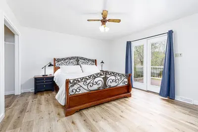 a bedroom with a bed and a ceiling fan at Enola Trail Getaway - bikes, rural, BBQ ,King bed, patio in Pequea