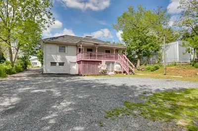 a house with a pink deck and a driveway at 9 Mi to Midtown Convenient Harrisburg Apt in Harrisburg