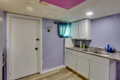 a kitchen with a white door and a sink at 9 Mi to Midtown Convenient Harrisburg Apt in Harrisburg