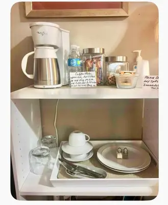 a kitchen shelf with a sink and utensils at Welcome to Grande Lux - Boutique Hotel Style- 20 mins to NYC Times Square in Englewood