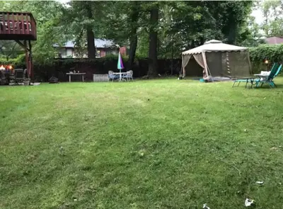 a lawn with a tent and chairs in a yard at Welcome to Grande Lux - Boutique Hotel Style- 20 mins to NYC Times Square in Englewood