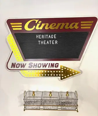 a sign for a therapeake heritage theater on a wall at Masthope Heritage Chalet in Lackawaxen