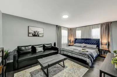 a bedroom with a bed and a couch at Leisurely Living in Long Pond in Long Pond