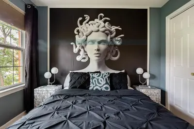 a statue of a woman with glasses on a bed at Modern-Chic Living in the Heart of Center City in Philadelphia