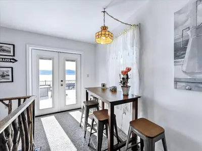a dining room with a table and chairs at Susquehanna Riverside Condo by Leavetown Vacations in Columbia