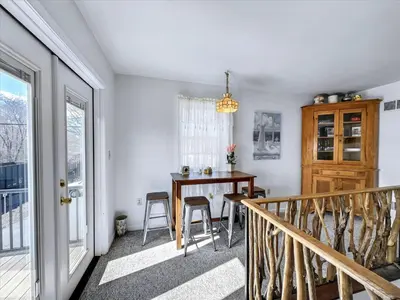 a dining room with a table and a window at Susquehanna Riverside Condo by Leavetown Vacations in Columbia