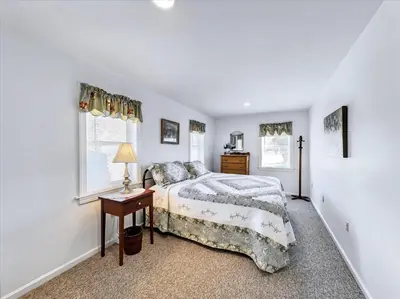 a bedroom with a bed and a desk and a window at Susquehanna Riverside Condo by Leavetown Vacations in Columbia