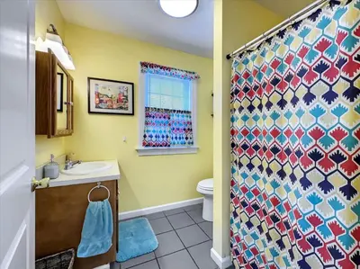 a bathroom with a shower with a toilet and a sink at Susquehanna Riverside Condo by Leavetown Vacations in Columbia