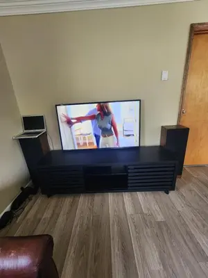 a large flat screen tv in a living room at 2BR in Peaceful Country Near Ithaca in Willseyville