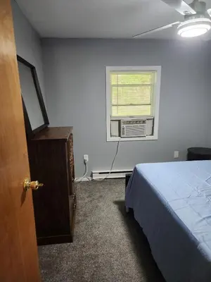 a bedroom with a bed and a window at 2BR in Peaceful Country Near Ithaca in Willseyville