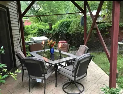 a patio with a table and chairs on a patio at Grande Lux Room- Boutique Hotel Style-15mins to NYC in Englewood