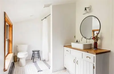 a bathroom with a toilet and a sink and a mirror at Catskills ChestnutCreek+Swimming Hole+Firepit+Hike in Neversink
