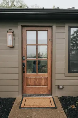a wooden door on a house with a window at Luxury Cabin getaway with hot tub and stunning views in Strasburg