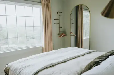 a bedroom with a bed and a large window at Luxury Cabin at Beaver Creek with hot tub and stunning views in Strasburg