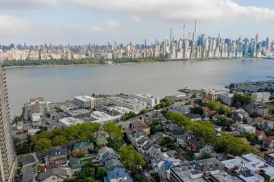an aerial view of a city with a river and buildings at Luxury Duplex in Hoboken 15Min to NYC, Fire Pit in Jersey City