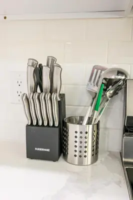 a container of utensils on a kitchen counter at 1Bed&1Bath KingBed,WIFI,WD,Central in Philadelphia
