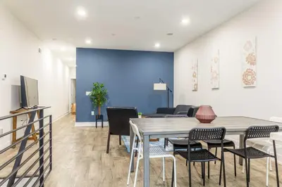 a dining room with a table and chairs at 4Bedrm,4Bath-BackyardWiFi WDCoffeeParking in Philadelphia