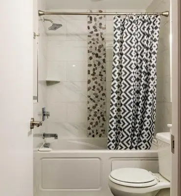a bathroom with a shower and a toilet at 4Bedrm,4Bath-BackyardWiFi WDCoffeeParking in Philadelphia