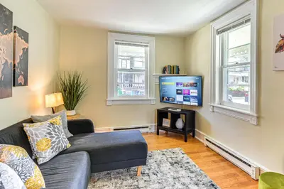 a living room with a couch and a tv at Near Nockamixon State Park Telford Apt with Porch! in Telford