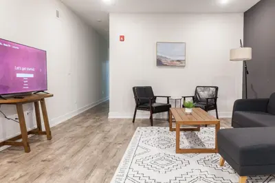 a living room with a couch and a tv at 4BR4Bath Home WiFi WD Ping Pong in Philadelphia