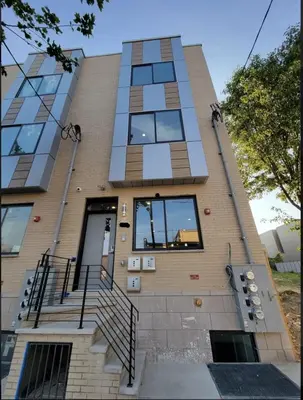 a building with stairs and windows on it at 4BR4Bath Home WiFi WD Ping Pong in Philadelphia