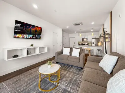 a living room with a couch and a table at Apartmint at Liberty A - Philadelphia in Philadelphia