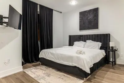 a bedroom with a bed with a stuffed animal on it at 2BR2BA ApartmentWDWiFi Near Temple in Philadelphia