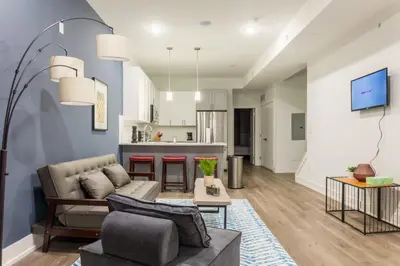 a living room with a couch and a table at Central Philly 2BR2BAWiFi WDSleeps 4-6 in Philadelphia