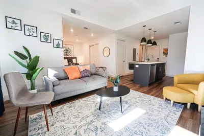 a living room with a couch and a table at 1BDRM & AptWifi near TrendyEateriesBrewerytown in Philadelphia