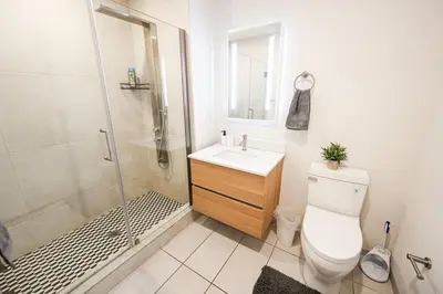 a bathroom with a toilet and a shower and a sink at 1BDRM & AptWifi near TrendyEateriesBrewerytown in Philadelphia