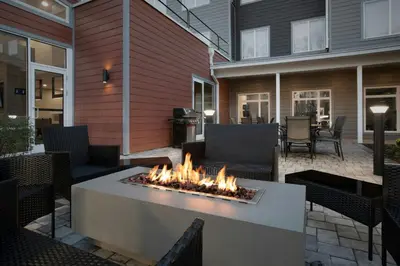a fire pit on the patio of a house at Residence Inn by Marriott Newark, DE in Newark