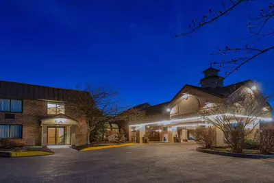 a building with a parking lot in front of it at Wyndham Garden York in York