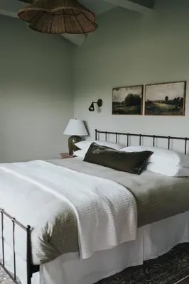 a bedroom with a large bed with white sheets at Luxury Cabin at Beaver Creek with Hot tub and stunning views in Strasburg