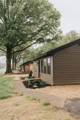 a small house with a tree next to it at Luxury Cabin at Beaver Creek with Hot tub and stunning views in Strasburg